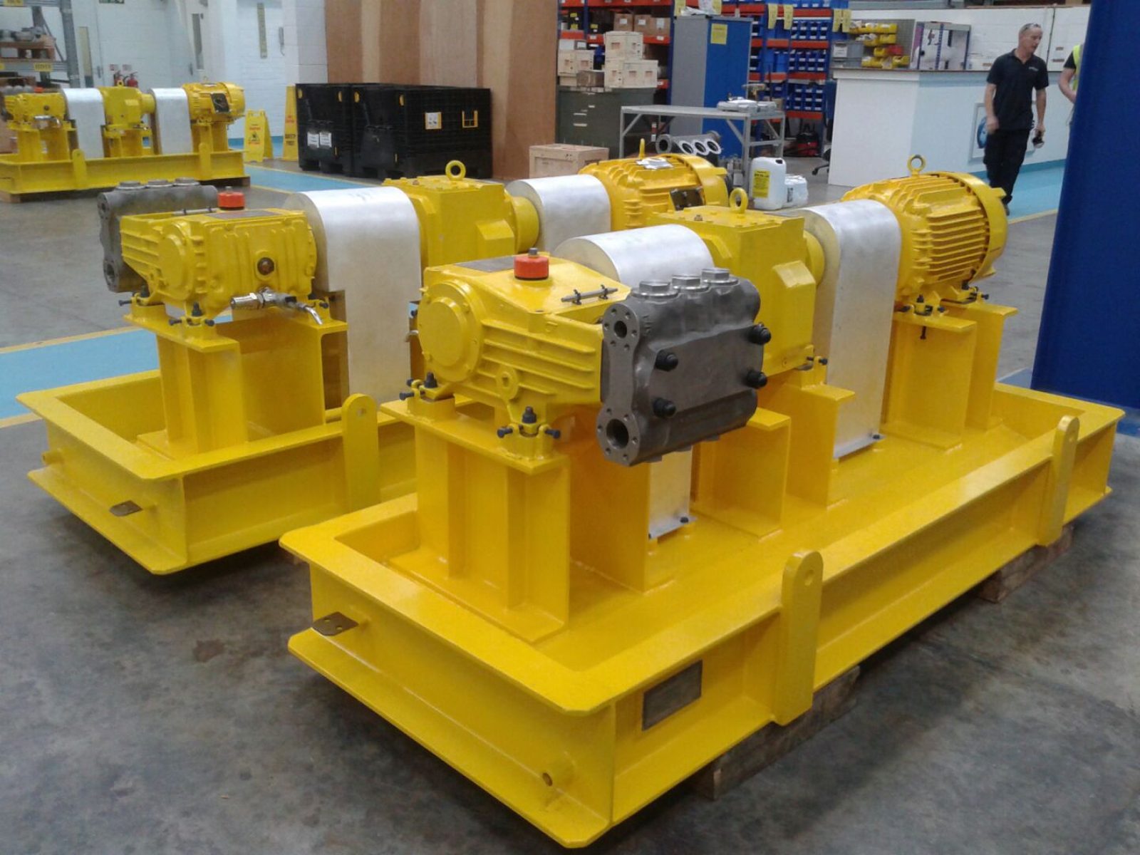 Multiple packaged pump skids awaiting pre-delivery inspection